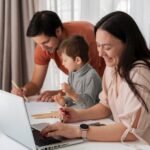 A stay-at-home mom working on a laptop while a dad and child engage in activities, highlighting ways to make money from home and balance family life.